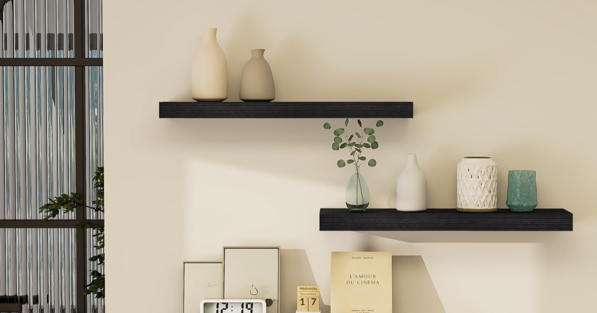 Black Vervida floating shelves styled on a light living room wall